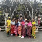 Bali travel group in front of a temple