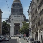 Brussels street with a domed landmark in the distance