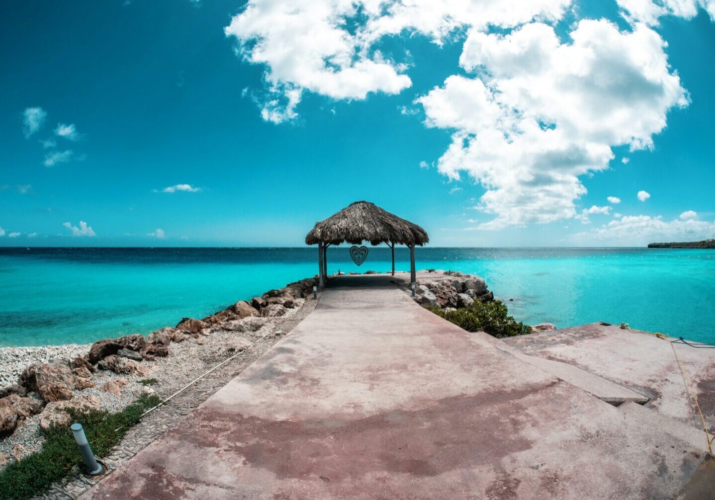 A quiet pier surrounded by turquoise Caribbean water